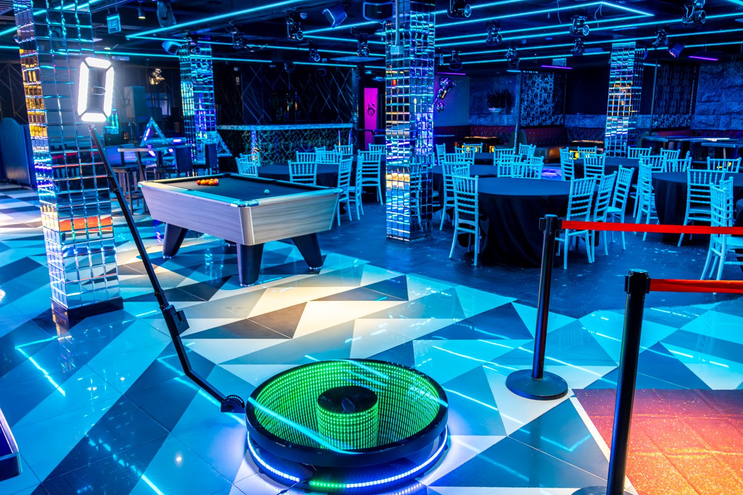 360 Glass Booth setup at a venue with neon lighting